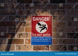 Danger, Do Not Enter Sign and Symbol on Brick Wall Stock Photo - Image of  protection, hazard: 120100312