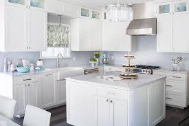 white kitchen with blue mosaic tile