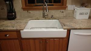 Hidden or decorative support brackets for grantite countertop overhangs. Farmhouse Undermount And Fireclay Sink Installation