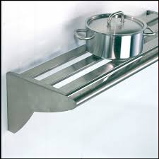 A generous steel shelf where you place jars, hot dishes or bowls to create more workspace on the countertop. Wall Shelf Commercial Kitchen Kitchen Wall Decor