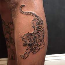 10 Best Crouching Tiger Tattoo Designs Petpress Leopard Tattoos Tiger Tattoo Design Tattoos