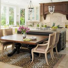 Bright blue metal bar stools add colour to the monochrome scheme. Kitchen Island Designs We Love Kitchen Island With Seating Kitchen Island Table Kitchen Island Dining Table