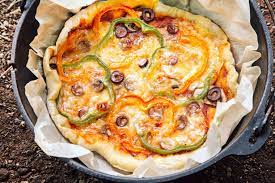 Dutch Oven Pizza Fresh Off The Grid Recipe Dutch Oven Pizza Dutch Oven Camping Recipes Dutch Oven Cooking