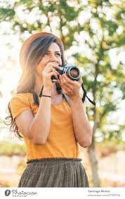 Check spelling or type a new query. Young Woman Using A Camera To Take Photo A Royalty Free Stock Photo From Photocase