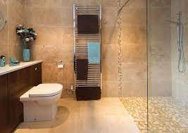 The floors are simple ceramic tiles in a finish that. Marble Bathroom Design Ideas Photos Inspiration Brown Bathroom Tile Bathroom Brown Bathroom Decor
