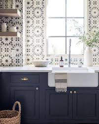 Quality cabinets & online convenience Stunning Blue And White Graphic Tiles On Sink Wall Of A Kitchen With Navy Blue Cabin Unique Kitchen Backsplash Cottage Kitchen Tiles Kitchen Backsplash Designs