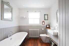 Black faucets with light wood vanity and black pulls. 17 Classic Gray And White Bathrooms
