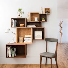 Made from manufactured wood, this understated storage unit features a solid color and a rectangular silhouette. Solid Wood Cube Shelves In Walnut Or Oak Nick James Design