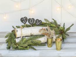 Birch Logs For Fireplace Display Style A Birch Log Bundle With Evergreen Garlands Gold Colored Candle Holders Glit Christmas Window Decorations Christmas Decor Diy Winter Floral Arrangements