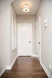 Wall trim is designed to hide joints, gaps, and other imperfections on surfaces, but most people add trim to their rooms because it is a bold design statement. A Neutral Wall Colour Paired With Bright White Trim Complemented This Flooring Beautifully Parliamentpainting Neutral Wall Colors Off White Walls Floor Trim