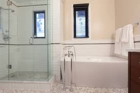 A minimal amount of framing makes the shower look spacious. The Pros And Cons Of Showers Vs Tubs