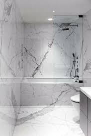 Go for mosaic glass tiles in a recurring border, or use a border of black tiles to divide a white and brown mosaic tile creation, breaking up the wall space. Top 70 Best Marble Bathroom Ideas Luxury Stone Interiors