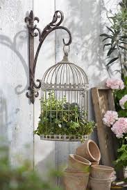 Bird Cage Decor Ideas Pinterest 72 Stunning Bird Cage Planters Ideas For Decorating Balconies In Every Detail Basic Rule For Classic Raised In 2020 Bird Cage Decor Flower Planters Birdcage Planter