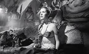 Carrie fisher in the 'slave leia' outfit. Behind The Scenes Return Of The Jedi Princess Leia With Boba Fett In The Background Image Galleries Boba Fett Fan Club