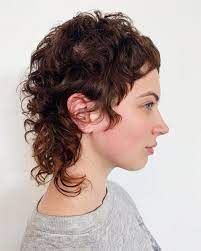 If the short haircuts for curly hair above don't fit your styling needs, then you may want to consider these medium to long wavy and wavy brushed back hair and beard. 13 Modern Androgynous Haircuts For Everyone