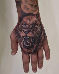 Lion Hand Tattoo In 2021 Lion Hand Tattoo Hand Tattoos For Guys Tattoos