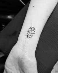 Small spiritual cross tattoo on wrist. 50 Deeply Symbolic Hamsa Tattoos You Can T Resist To Get Inked Hamsa Tattoo Hamsa Hand Tattoo Small Hamsa Tattoo