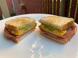 Bacon or ham and two eggs. Toasted Ham Egg Sammy On Sourdough W Guacamole And Cream Cheese 372 Kcal 1200isplenty