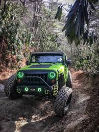 Green Halo Headlights And Fog Lights On A Green Jeep Wrangler Jk Rgb Led Combo With Bluetooth App An Jeep Lights 4 Door Jeep Wrangler Jeep Wrangler Accessories