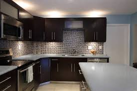 Kitchen interior black kitchen island white cabinetry herringbone backsplash countertop inspiration new kitchen modern farmhouse get ideas for how to make a statement in your kitchen, dining room, or bathroom with matte black countertops, cabinets, fixtures, paint, and more. Iced White Quartz Dark Kitchen Cabinets White Granite Countertops Kitchen Design Ideas Dark Cabinets