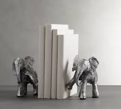 Featuring a shining silver finish and cool sculptural design, these elephant bookends add a dose of creativity to book storage. Elephant Bookends Decorative Objects Pottery Barn