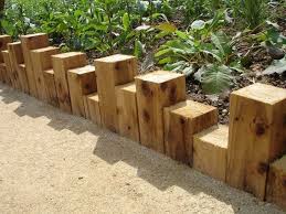 Eleven Interesting Garden Bed Edging Ideas Wooden Garden Edging Wood Garden Edging Outdoor Garden Decor