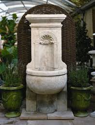 This Hand Carved French Limestone Moyenne Coquille Fontaine Surrounded By Our Green Vase Anduze Pottery Wi Limestone Fountain French Limestone French Fountains
