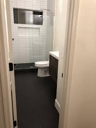 Black Penny Tile With Black Grout Shower Has 3x12 White Subway Tile With Grey Grout Penny Tiles Bathroom Bathroom Solutions Tile Bathroom