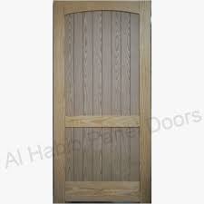 These doors feature glass panels with hinges on opposite ends of the frame, so the door jambs meet in the middle to open and close. Yellow Pine Wood Frame With Ash Mdf Solid Door Hpd585 Semi Solid Wood Doors Al Habib Panel Doors Solid Doors Solid Wood Doors Wood Door Design