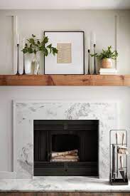 For A Timeless Mantel Setup We Framed A Page Of Sheet Music And Flanked It With Some Simple Green Home Fireplace Fireplace Mantle Decor Fireplace Mantel Decor