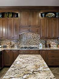 When you have white cabinets and stainless steel appliances. Using A Different Backsplash Not The Same Granite As Your Counter Top Kitchen Cabinets And Granite Granite Kitchen Brown Granite Countertops