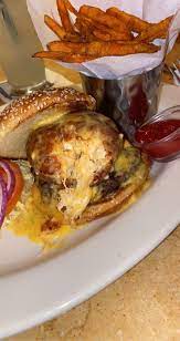 Macaroni and cheese burger cheesecake factory. The Macaroni And Cheese Burger At The Cheese Cake Factory Pictured Is A Ball Of Fried Mac N Cheese Smothered In Cheese Balls And Cheddar Cheese Sauce Burgers