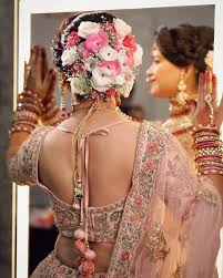 What a beautiful large low bun covered with jasmine. Bridal Floral Bun Hairstyles For Wedding Day K4 Fashion