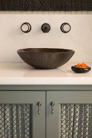 gray sink vanity with metal grille