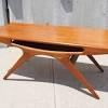 Vintage danish coffee table in teak and magazine shelf in cane. 1