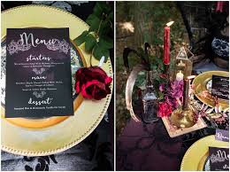A black wedding cake with a white whipped cream top for a soft gothic wedding. Feathers And Skulls Gothic Wedding Inspiration For A Happy Halloween Boho Wedding Blog