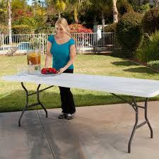 80277 Lifetime Eight Foot Fold In Half Table Next To Grass Folding Table Garden Bbq Table