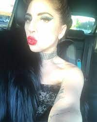 Intertwined in the hairstyle was a black ribbon that contrasted against her platinum blond hair. Have You Seen Lady Gaga S Jet Black Hair