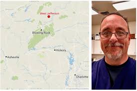 An embalmer worked by flashlight as the floodwaters rose