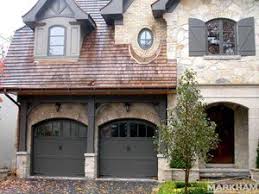 This garage door color works best with brown houses and is a foolproof option for monochromatic exterior palettes. Richards Wilcox 017 Markham Garage Doors Ltd