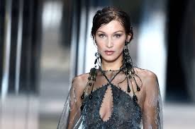 She is pictured in the photos wearing a keffiyeh, a traditional headdress. Fc1r7zvfurqsum