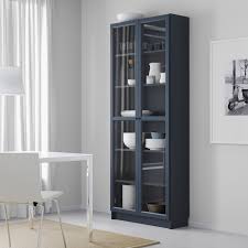 For this unit his client wanted something that would conceal a sump well. Billy Bookcase With Glass Doors Dark Blue 31 1 2x11 3 4x79 1 2 Ikea