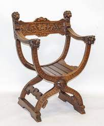 een eikenhouten dagobert stoel met snijwerk w o leeuwenkoppen en grotesken holland ca 1900 stoelen snijwerk catalogus