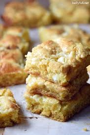 These Lemon Gooey Bars Get A Triple Dose Of Lemon From Lemon Cake Lemon Zest And Lemon Curd Moist Chewy And Amaz Easy Lemon Curd Gooey Bars Lemon Recipes