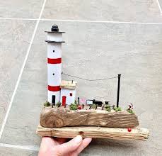 If the bottom of your new pot holds water. Driftwood Lighthouse Lighthouse And Cottage Driftwood Decor Etsy Driftwood Decor Driftwood Art Lighthouse