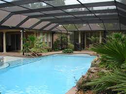 The next type of screen enclosure we are going to talk about are screen enclosures with the screen roof, like a pool cage. Pool Enclosures Outdoor Living Indoor Comfort Backyard Paradise Inc