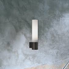 Brighter bathroom lighting makes precision tasks, like applying makeup and shaving, easier and installing a combination of bathroom light fixtures, including wall and ceiling lights, will reduce shadows cast across your face. Small Tube Bathroom Wall Light Cl 34998 E2 Contract Lighting Uk