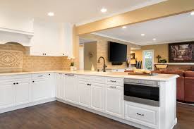 Most of the time, people choose hardware that matches the style of their kitchen — be it victorian, colonial, craftsman etc. Kitchen Remodel In Cypress Ca With Quartz Countertops Custom White Raised Panel Cabinetry Bronze Hardwa Wood Floor Bathroom Classic Kitchens Kitchen Remodel