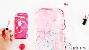 The floating paints are swirled into patterns. 3 Easy Steps To Make Your Own Water Marble Cell Phone Case Sheknows