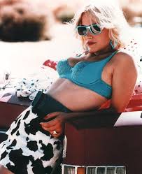 Cassie's skirt is the funk therapy mini skirt by delias by dolls kill. Alabama Worley Bra